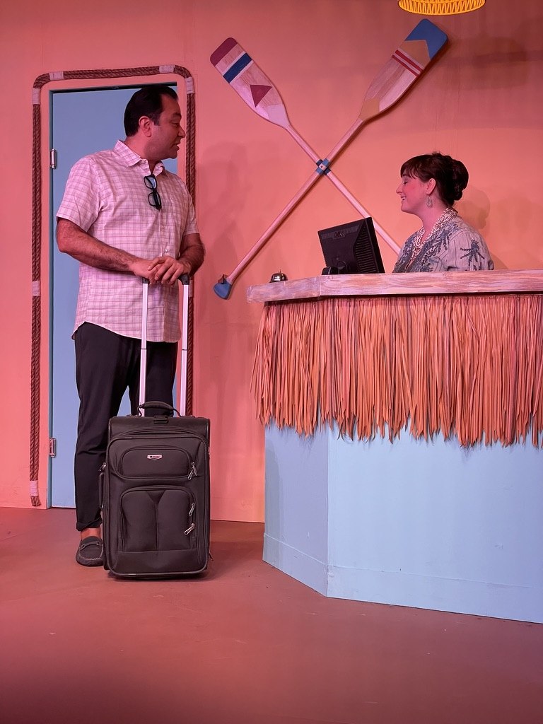 Gautam Kannan performing on stage in "Sandy Toes and Salty Kisses"